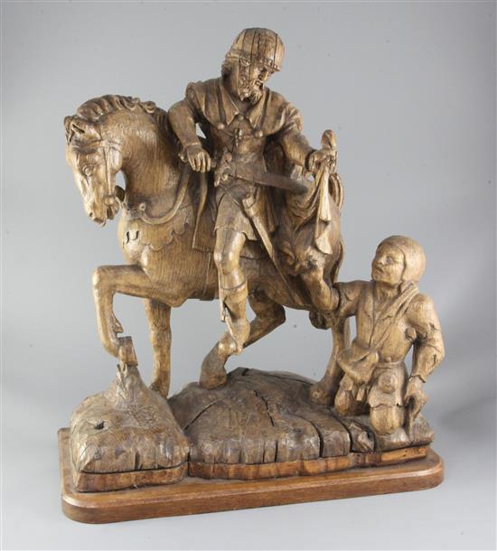 A 16th century South Netherlands oak carving of St Martin and the beggar, height 22in. width 18.5in.